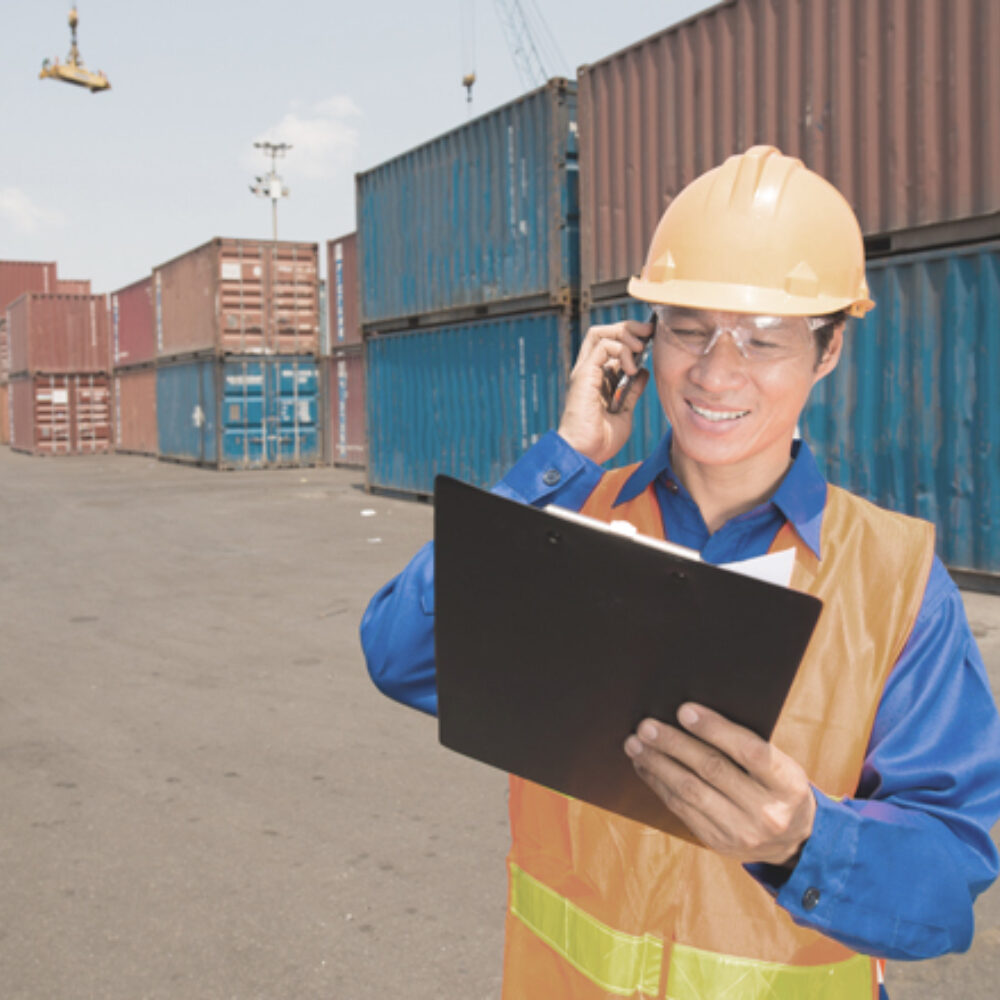 Man in hardhat speaking on phone