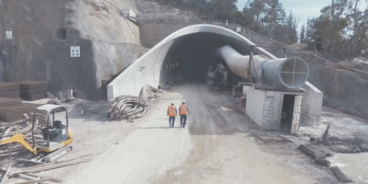Mining video Men standing outside a mining tunnel